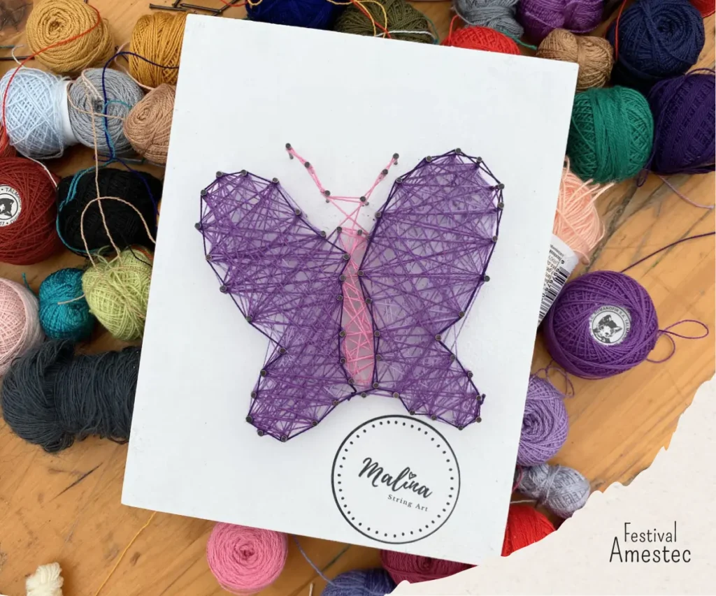 Tablou string art cu fluture realizat la atelierul creativ la festivalul amestec